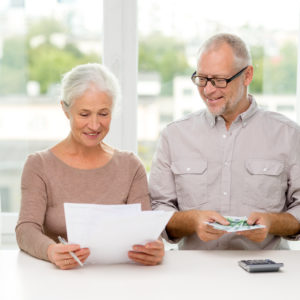 senior couple with money ageing in place