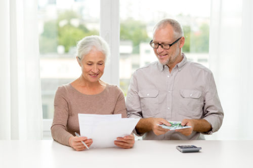 senior couple with money ageing in place