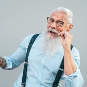 A man with long white beard and glasses