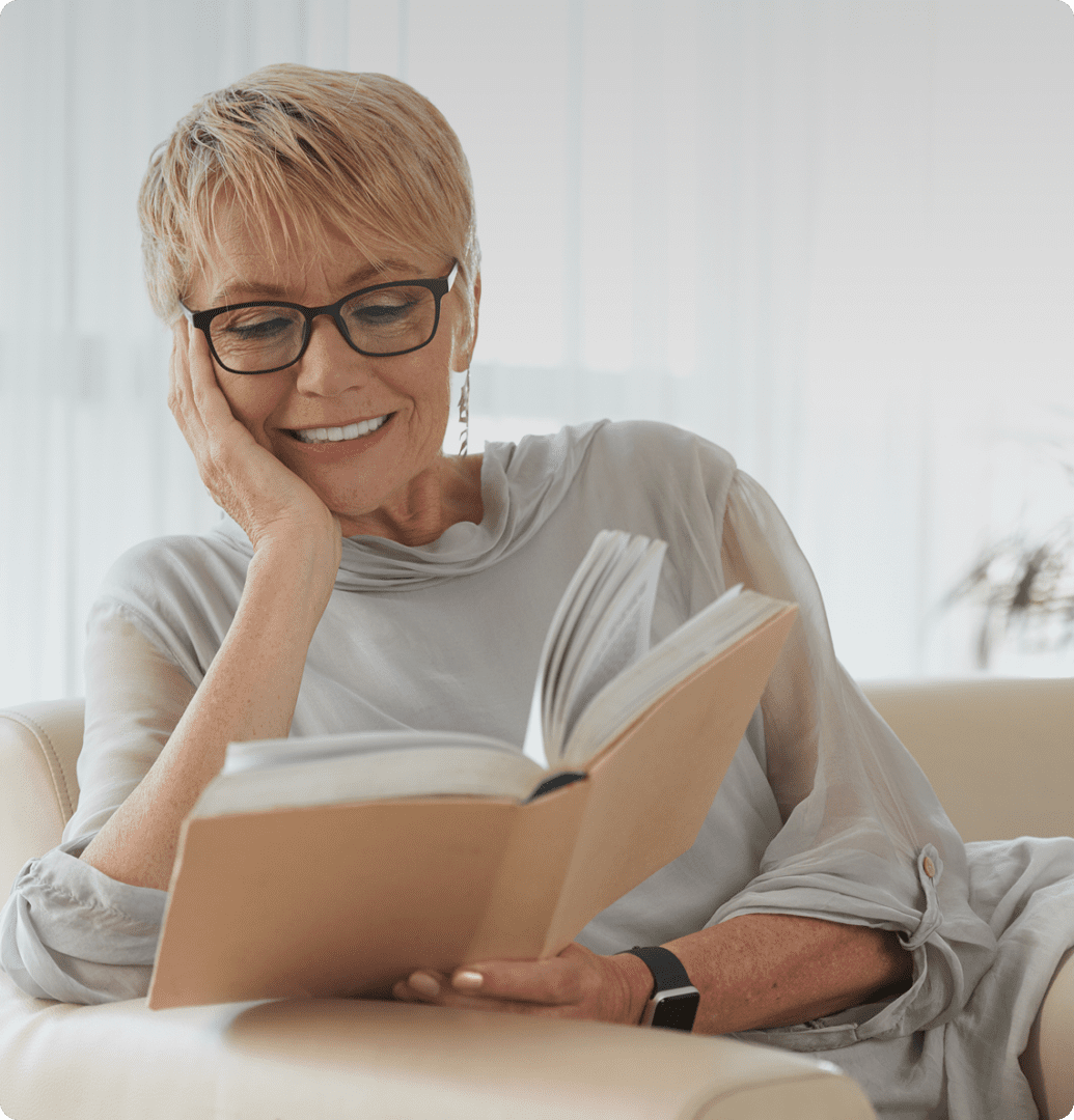 Woman reading a book happily